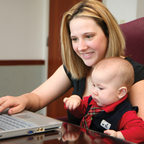 mother-on-laptop-with-baby1440