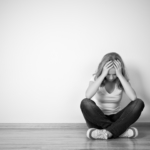 teen-girl-depressed-sitting-mono2160