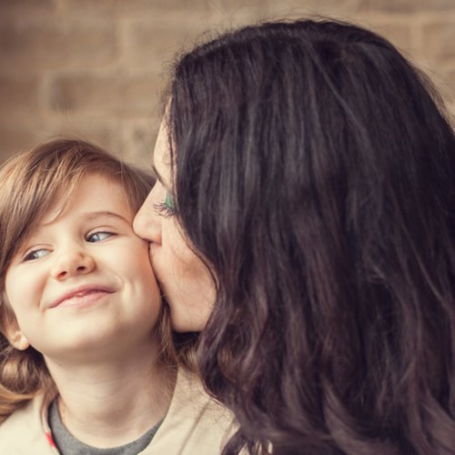 Mother-Kissing-Dauther-on-Cheek1440