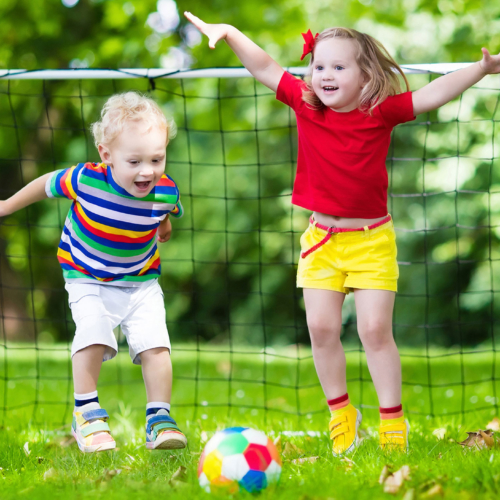 2 little kids playing football