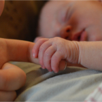 baby-hand-mother-closeup2160