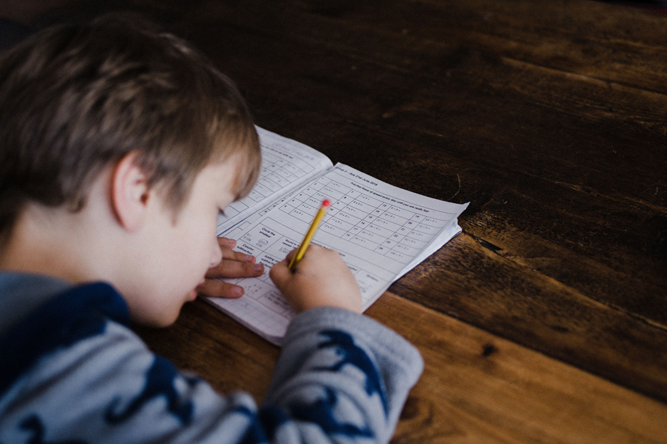 boy-writing-maths-homework2160