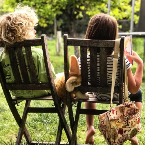 two-kids-reading-outside2160