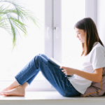 girl-reading-sitting-by-window2160