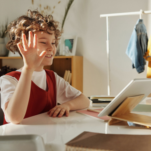 child-waving-at-tablet-video-call2160