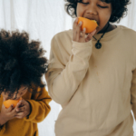 hungry-ethnic-kids-with-fresh-fruit-in-studio-4546113