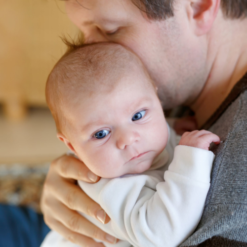 father-cuddling-baby2160