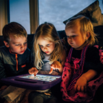three-children-on-ipad-playing2160