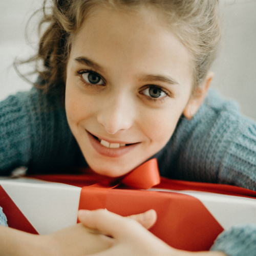 girl-hugging-her-present2160