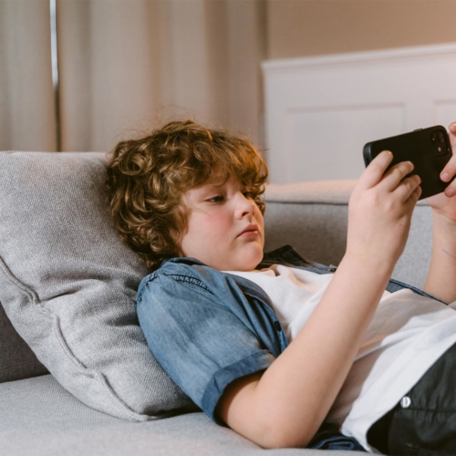 tween-boy-playing-on-iphone2160