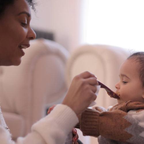 woman-feeding-her-child2160