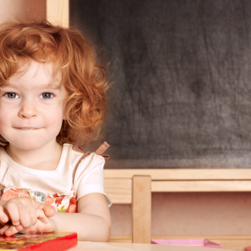 young-girl-with-book-at-kindy2160
