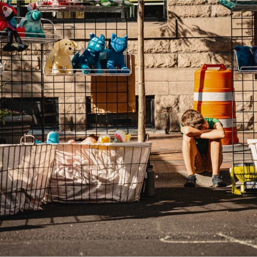 boy-selling-toys-outside2160