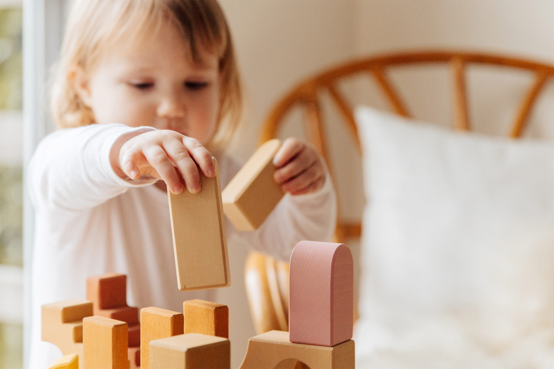 little-girl-playing-wooden-blocks2160