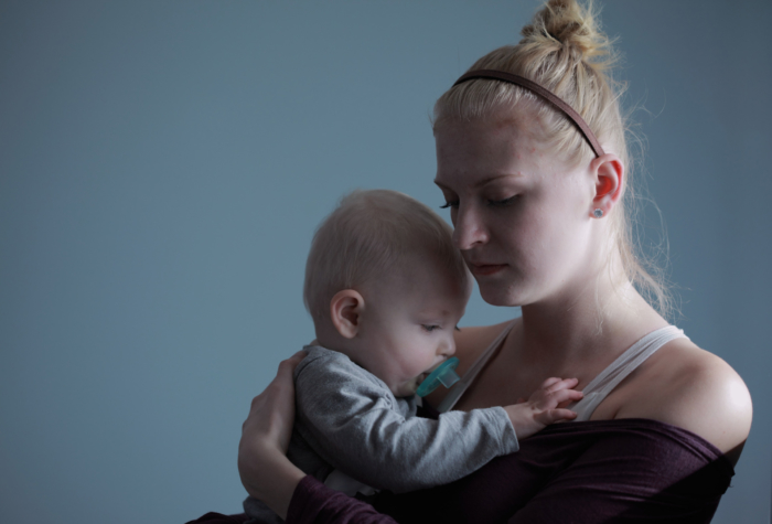 sad-young-mother-with-baby