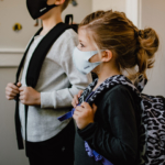 two-children-ready-for-school-with-masks