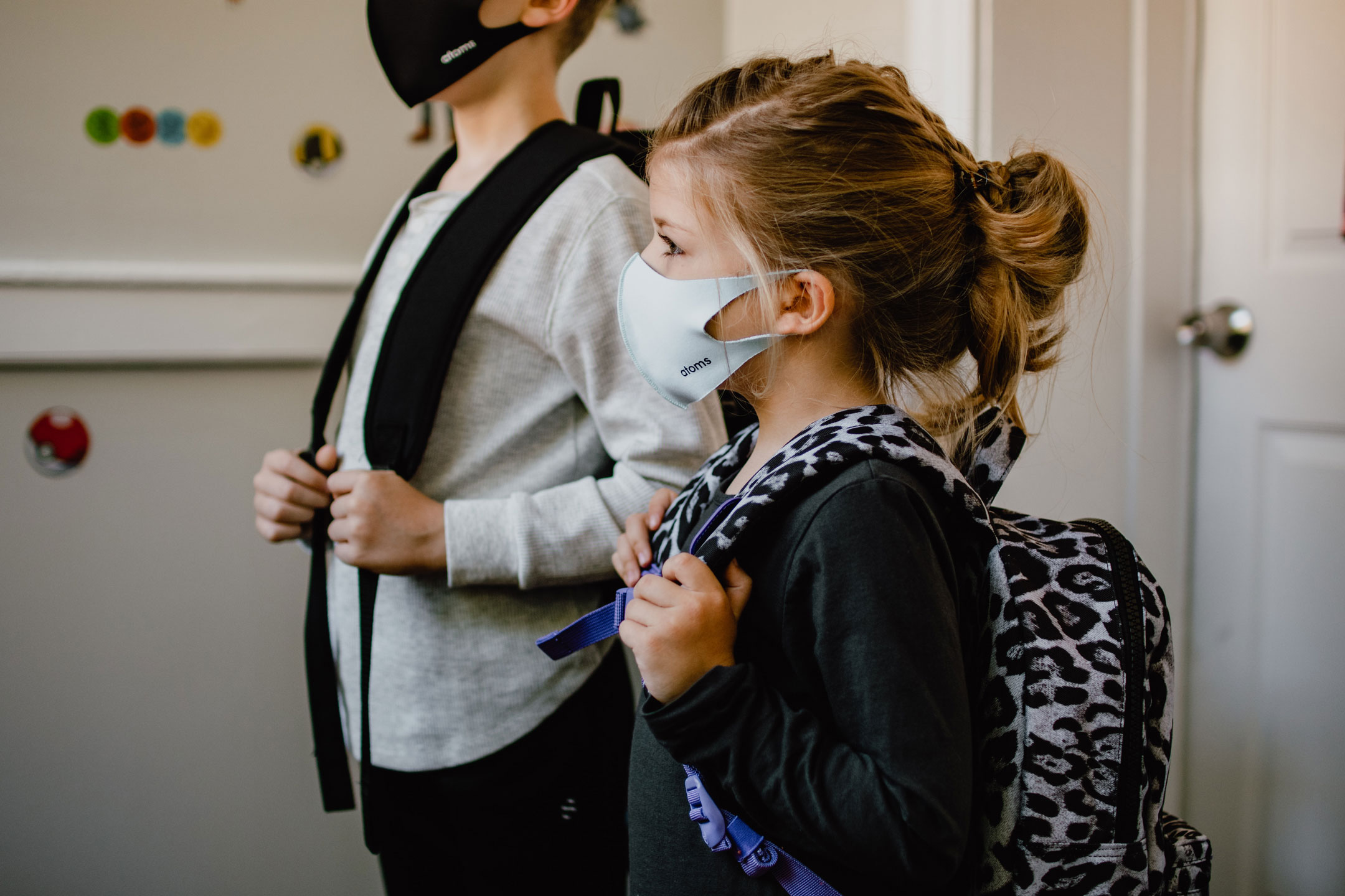two-children-ready-for-school-with-masks
