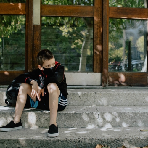 back-to-school-masked-boy-seated2160