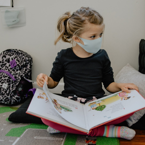 young-school-girl-reading-with-mask-on-2160
