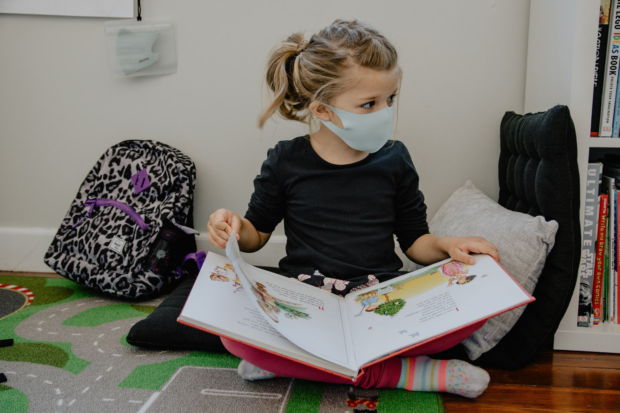young-school-girl-reading-with-mask-on-2160