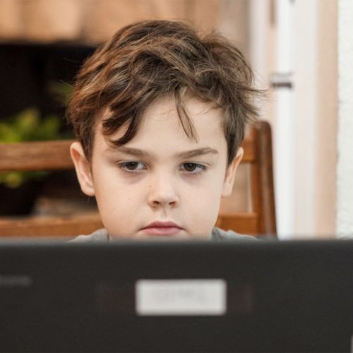 anxious-boy-child-looking-at-laptop2160