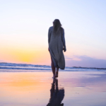 lonely-woman-walking-along-beach2160