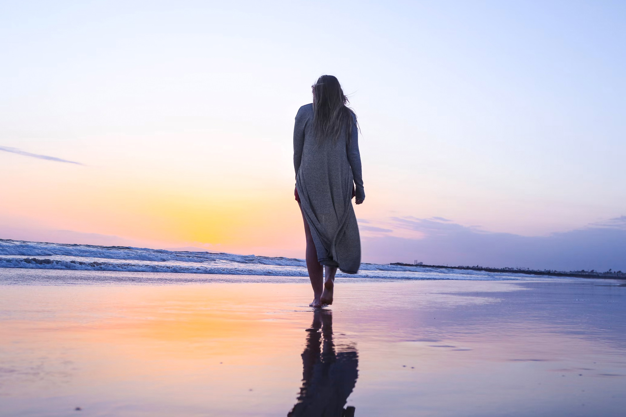lonely-woman-walking-along-beach2160