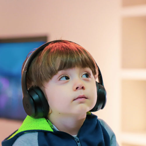 young boy with earphones